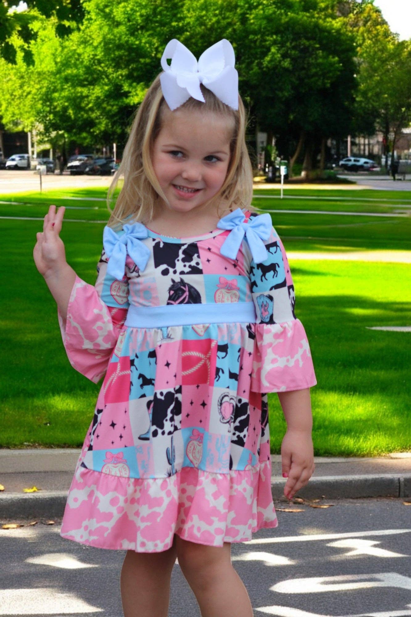 Kids Charm Online - Wholesale Dress - Kids - Beautiful wester patch printed girls dress with bows and cow printed hem.6