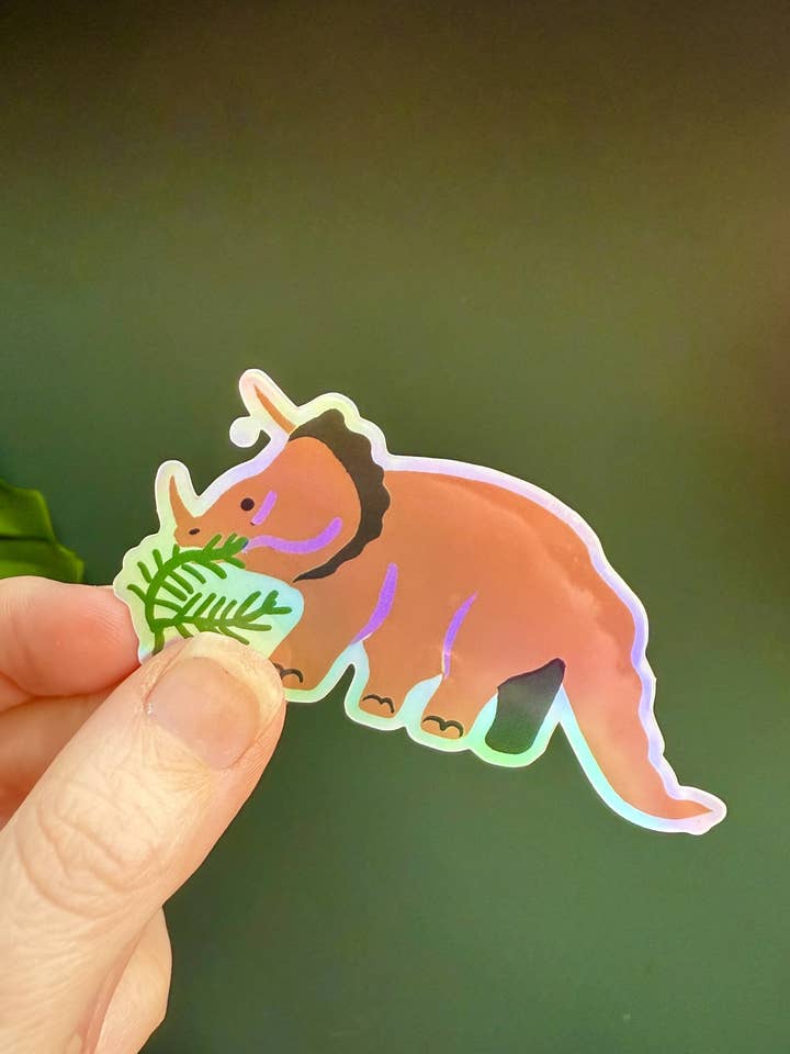 Triceratops holografische sticker voor wholesale door naomi wilkinson illustration