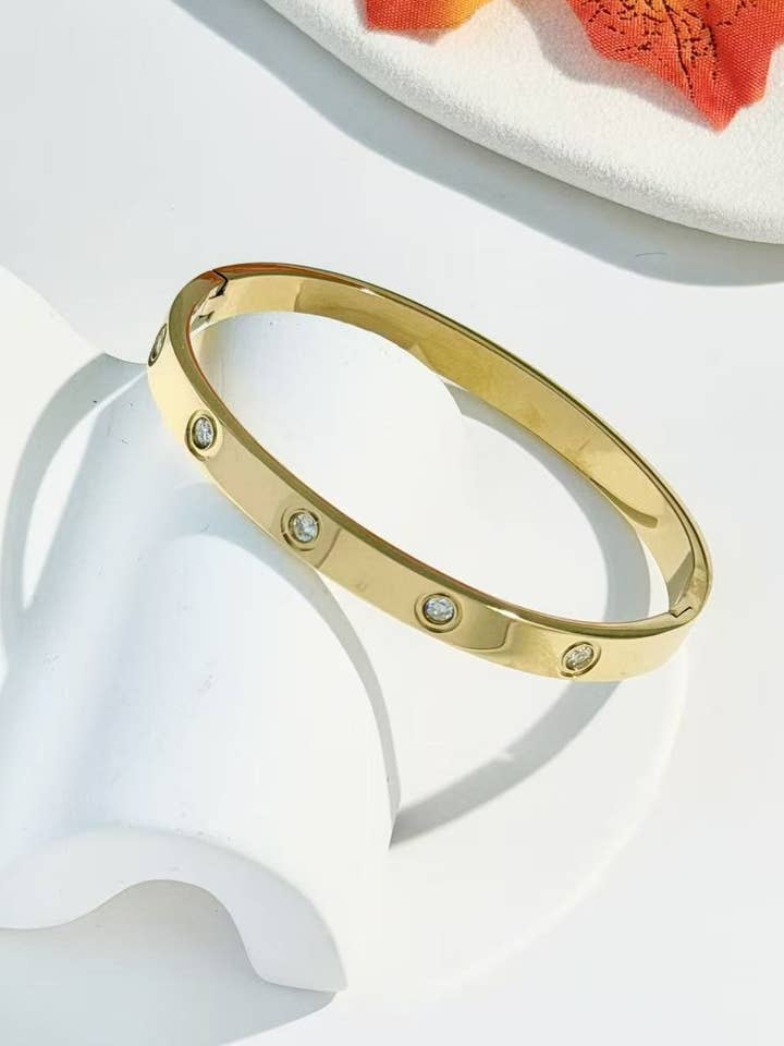 Gold bangle stainless steel Adorned with crystal for wholesale by COSMOS