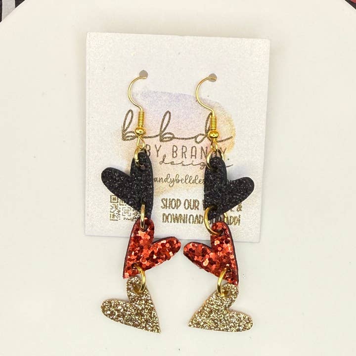 CUORI COLLEGATI - Collezione Cuori Piccoli || Orecchini in Pelle || <BR> NERO, ROSSO SPESSO E GLITTER ORO SU PELLE SPESSA per la vendita all'ingrosso da parte di Brandy Bell Design