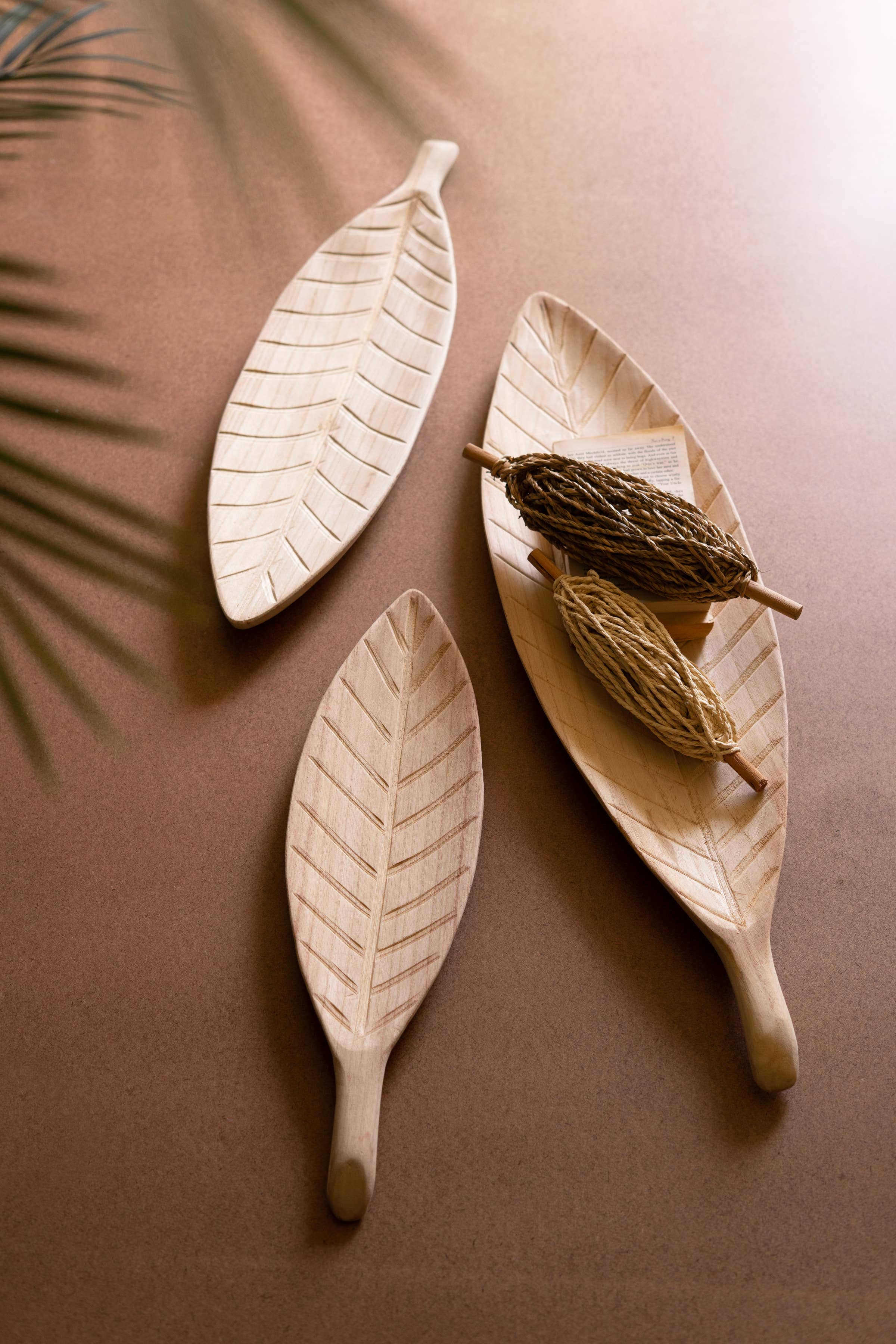 Natural SET OF THREE WOODEN LEAF TRAYS  for wholesale on Faire2