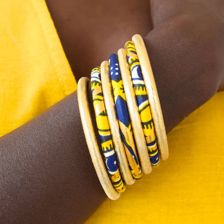 Braccialetti rigidi in cera di cotone africano blu navy, giallo e oro per la vendita all'ingrosso da parte di Melokane