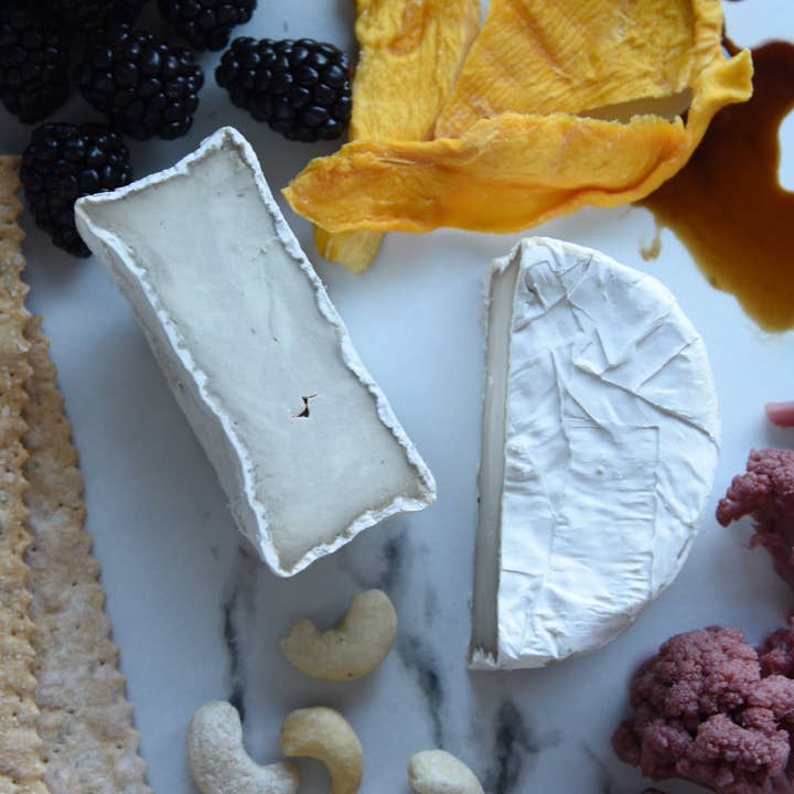 Cave-Aged Truffle Brie Plant Based - 27 oz for wholesale by Rebel Cheese