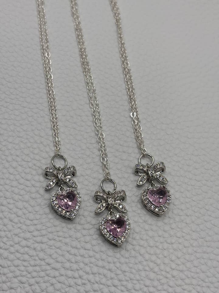 Felicity Pink heart and bow cz necklace for wholesale by Penny Lane Jewelry Co