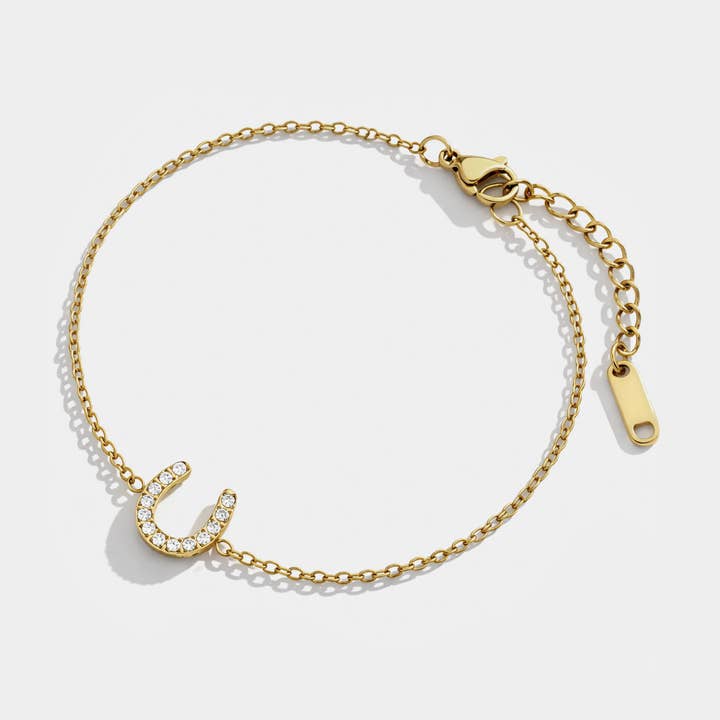 Hästsko guldarmband i rostfritt stål & kubisk zirkonia - SF253B026GL för wholesale av Bizou