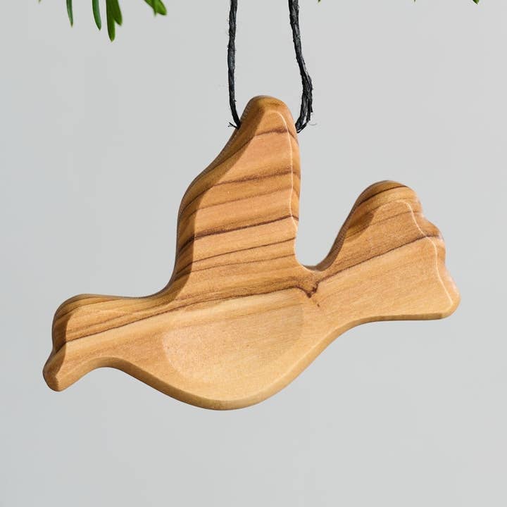 Olive Wood Pocket Peace Dove for wholesale by Ten Thousand Villages
