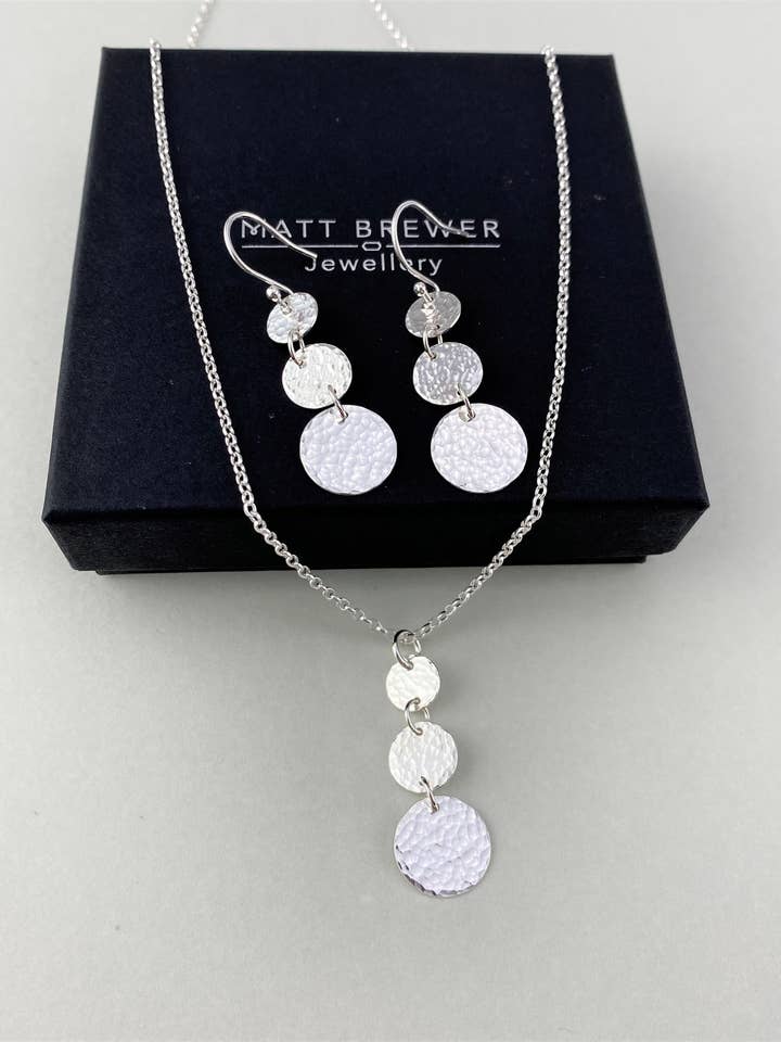 Hammered Sterling Silver Circle Earrings and Pendant Set for wholesale by Matt Brewer Jewellery