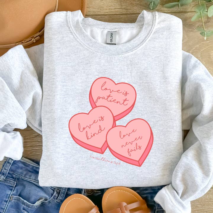 Love is Patient, Love is Kind, Love never fails. 1 Corinthians 13:4-8. - Valentine Inspired Christian Apparel - Sweatshirt for wholesale by God Influenced Apparel