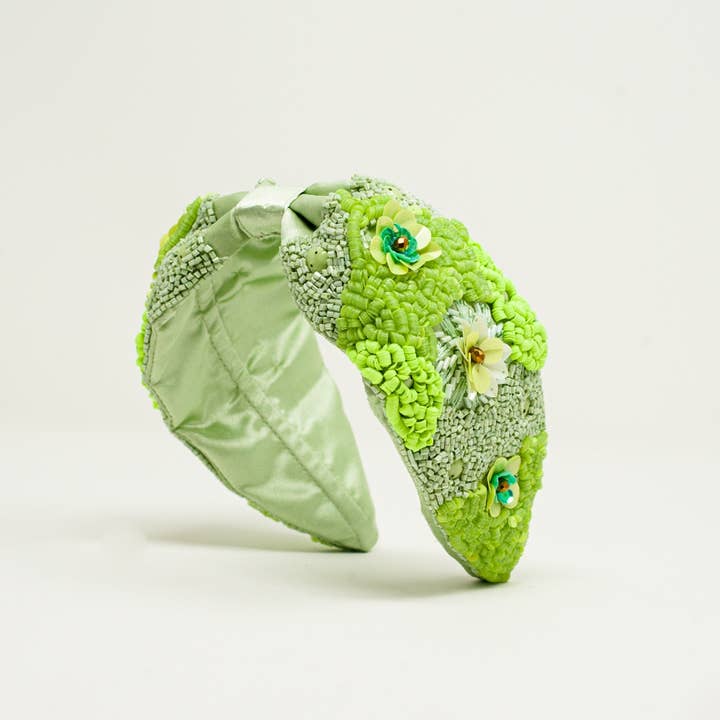Chunky headband with embellished green flowers for wholesale on Faire2