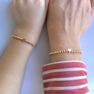Gold bracelet best sale for daughter