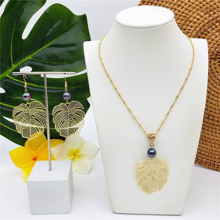 Set Of Hawaiian Monstera Leaf Earrings And Necklace Sustained With A Pearl In Different Colors for wholesale by S&T Collections