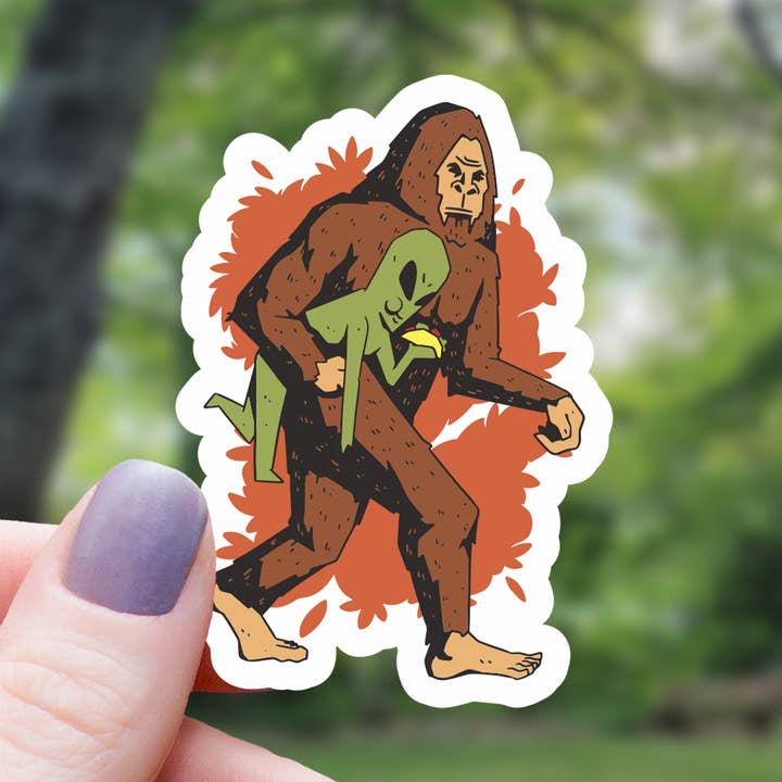 Yeti Kidnapping Alien Funny Sticker - 3" for wholesale by Mimic Gaming Co