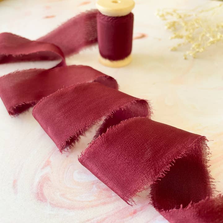 Burgundy Silk Ribbon | Raw Edge Silk Ribbon on a Wooden Reel for wholesale by The Natural Paper Company