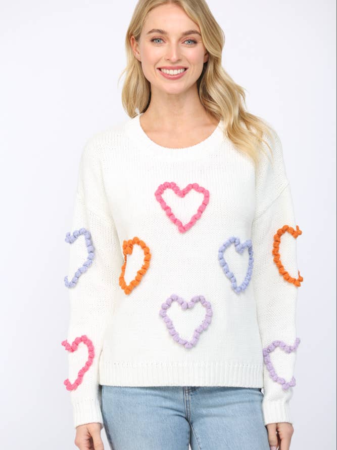 PULL À COL ROND AVEC DÉTAIL APPLIQUÉ CŒUR TRESSÉ 3D FW10319 pour la vente par FATE