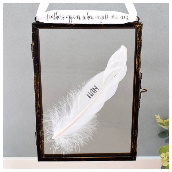 NAN Memorial White Feather Hanging Frame.Memory Home Decor for wholesale by Amaya Rose Ltd.