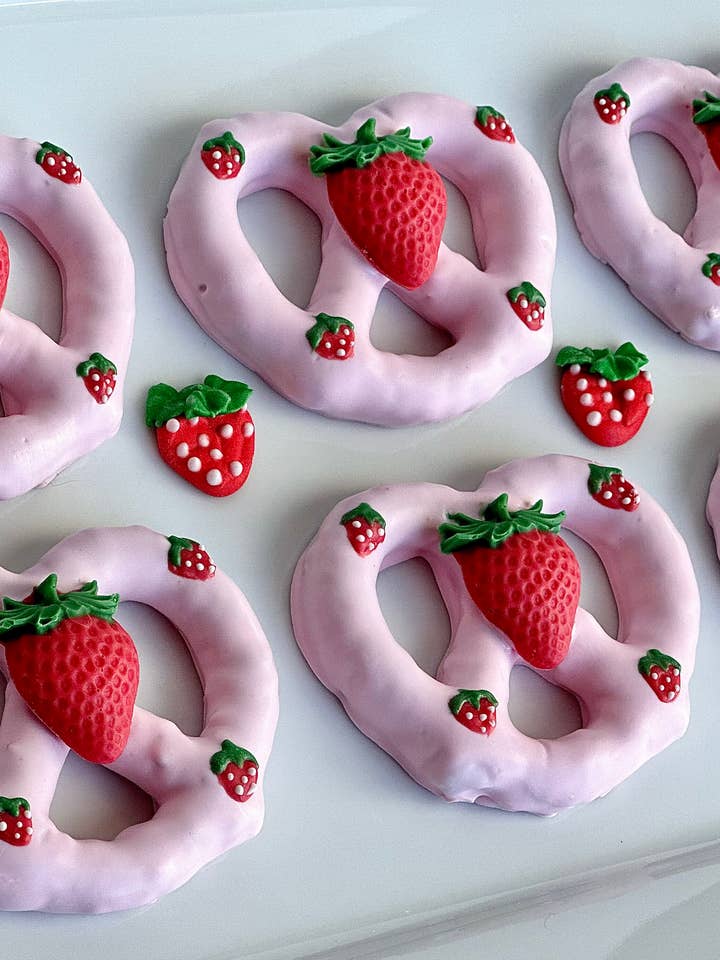 Strawberry Themed Pink Chocolate Covered Pretzel Twists for wholesale by Delightful Chocolates