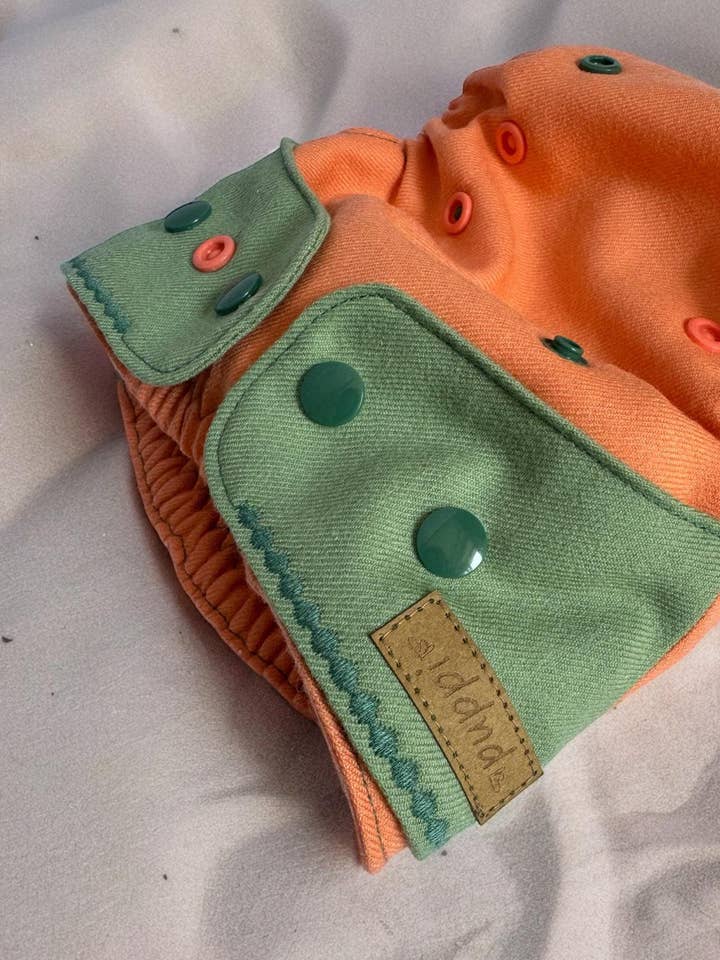 Funda de lana merino «Melon» Mini Os para venta al por mayor de Puppi