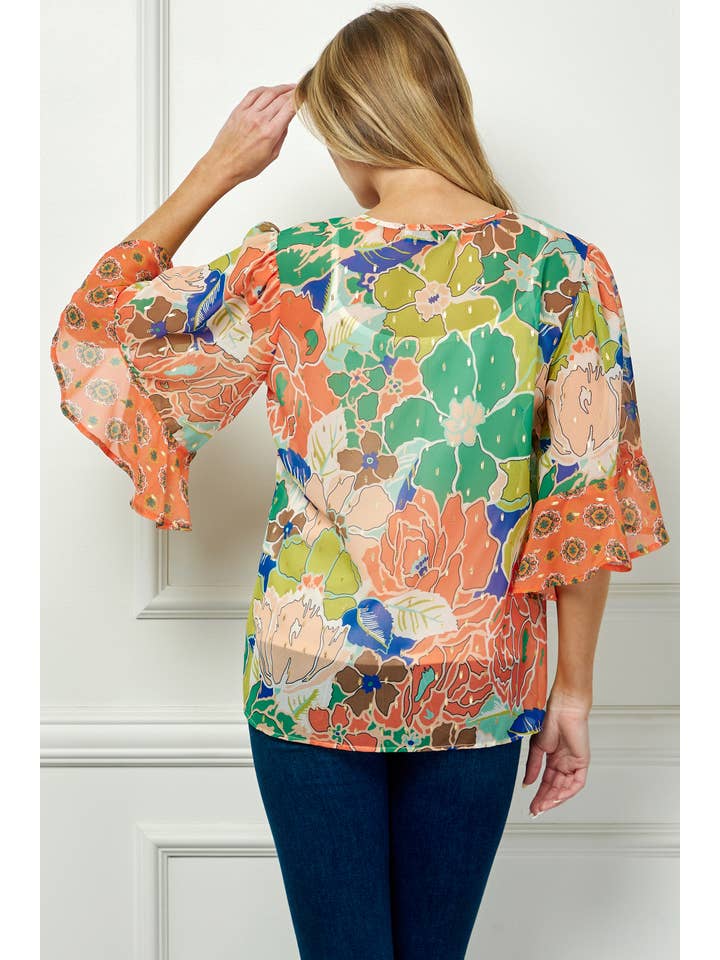 GREEN CORAL MISSY SHEER PRINTED PEASANT BLOUSE COU95L78 for wholesale on Faire2