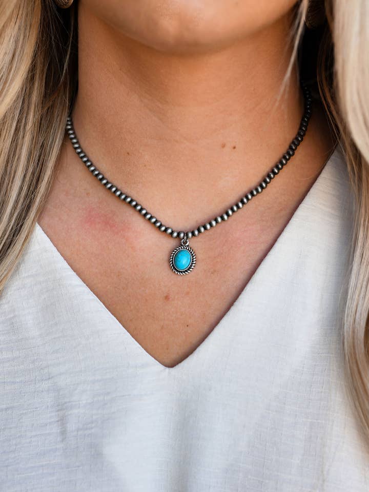 13" Dainty Faux Navajo Pearl Necklace With Oval Turquoise Pendant for wholesale by West & Co.