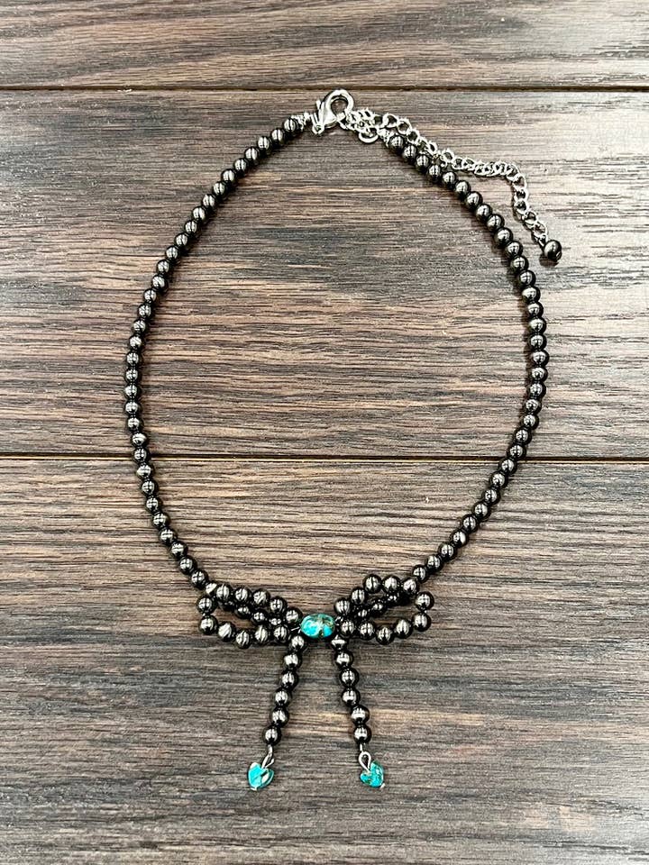 739623, Handmade 17" Bow, 6mm Polish Navajo Bead Necklace for wholesale by ISAC Trading Inc