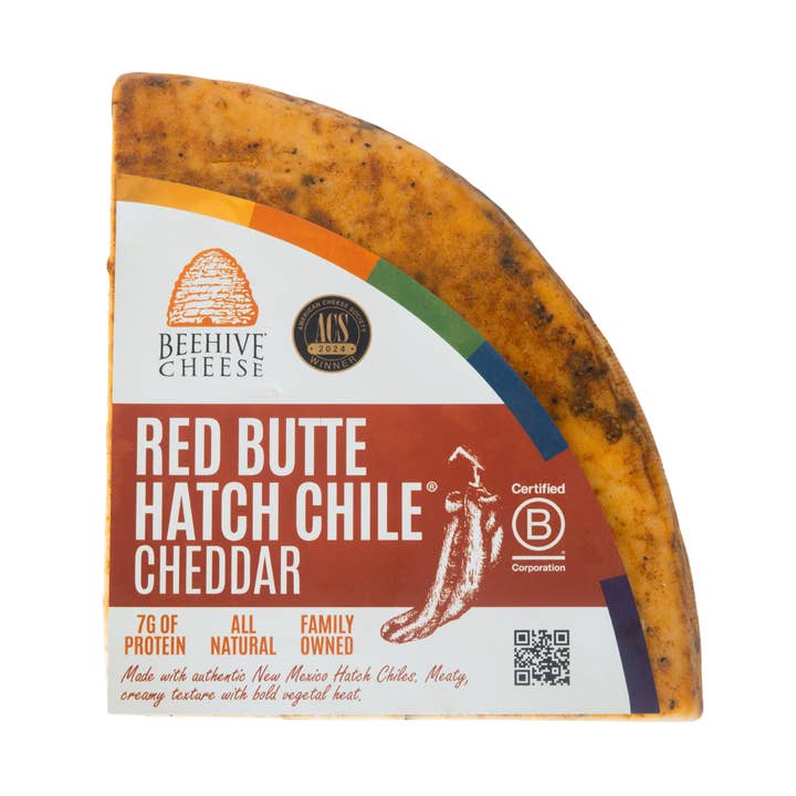Red Butte Hatch Chile Rubbed Cheddar 1/5LB Case for wholesale by Beehive Cheese Co. LLC