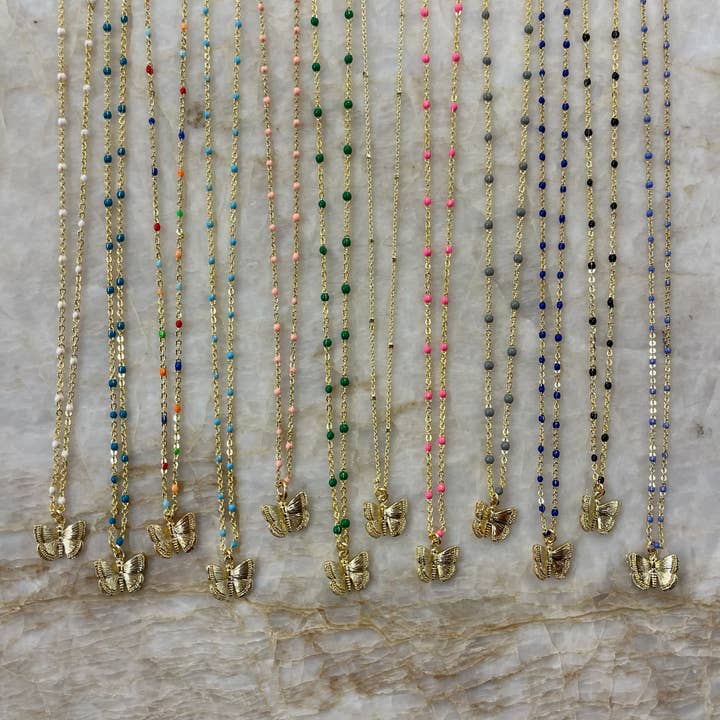 Gouden halsketting met geëmailleerde bedeltjes met vlinder voor wholesale door Lauren Ferrell Designs