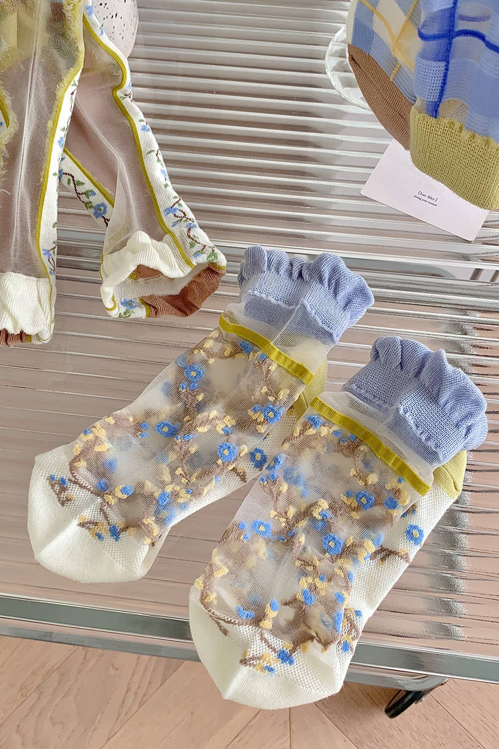 Sheer socks with blue flowers 💙🌼 for wholesale on Faire5