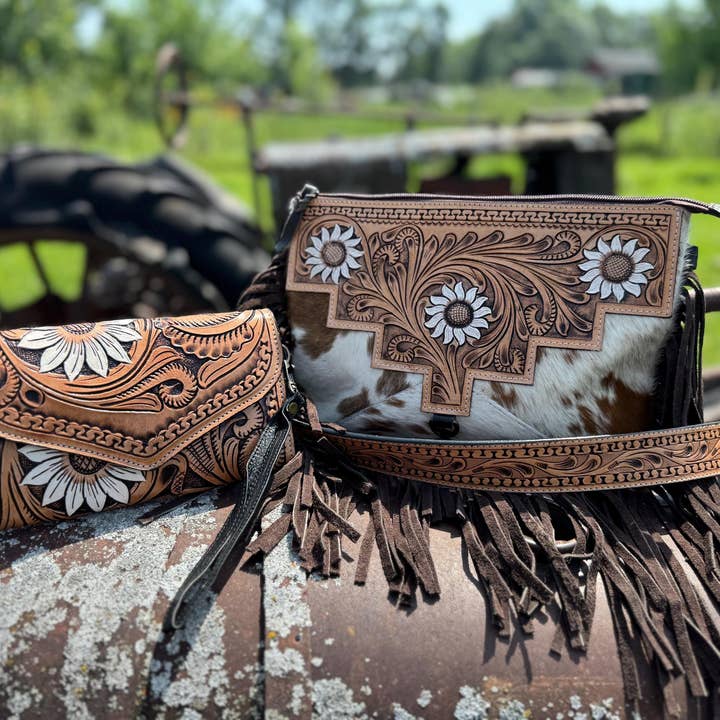 Genuine Western Cowhide Leather Purse and Clutch with white floral painted details a Double B Wild Rags Exclusive and other Purchase Wholesale cow hide purse. Free Returns & Net 60 Terms on Faire trending on Faire.