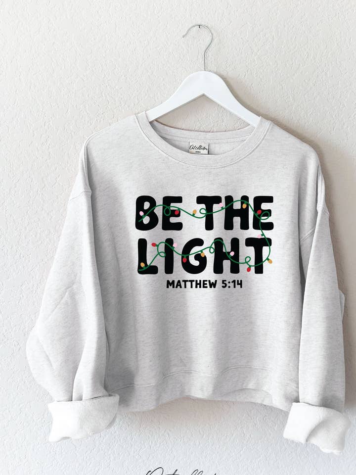 BE THE LIGHT Mid Graphic Sweatshirt and other Purchase Wholesale be the light. Free Returns & Net 60 Terms on Faire trending on Faire.