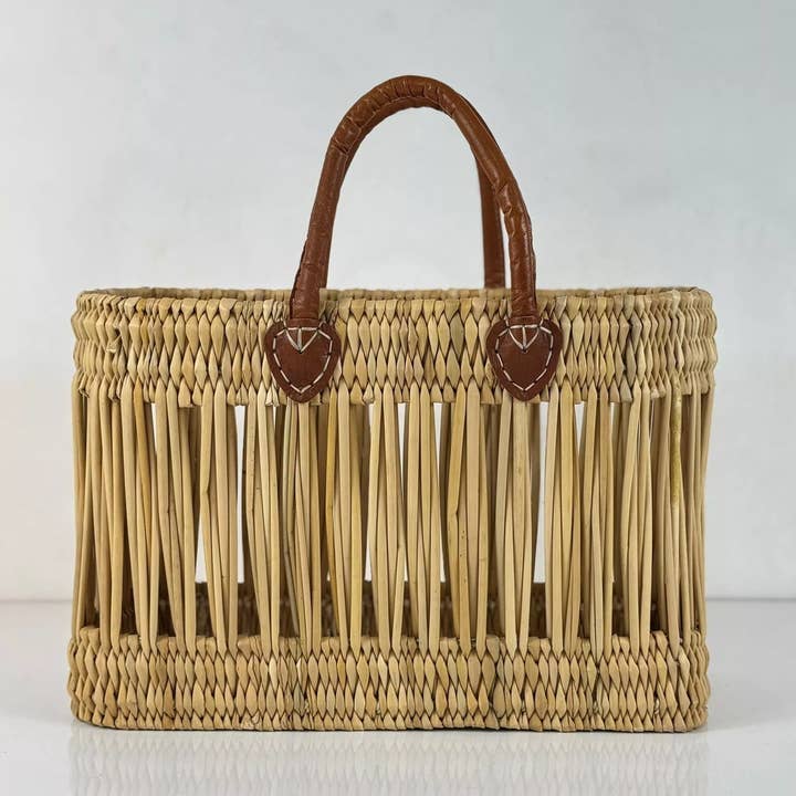 Handmade Open Reed Basket with Leather Handles for wholesale by Moroccan Natural bazaar