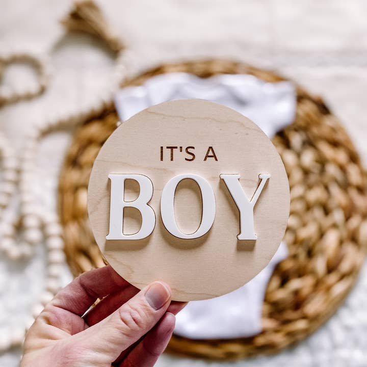 It’s a Boy Gender Reveal Announcement Sign - Round for wholesale by Claire and Bella