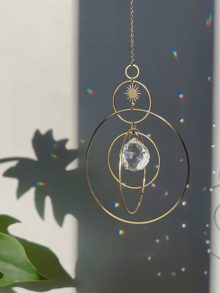 COSMIC • Brass and glass crystal suncatcher for wholesale by Atelier Intuitive