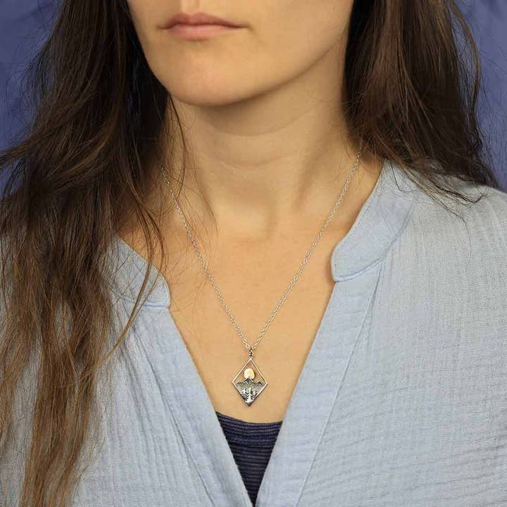 Nina Designs - Wholesale Pendant/Charm Necklace - Sterling Silver Mountain Necklace with Bronze Sun1
