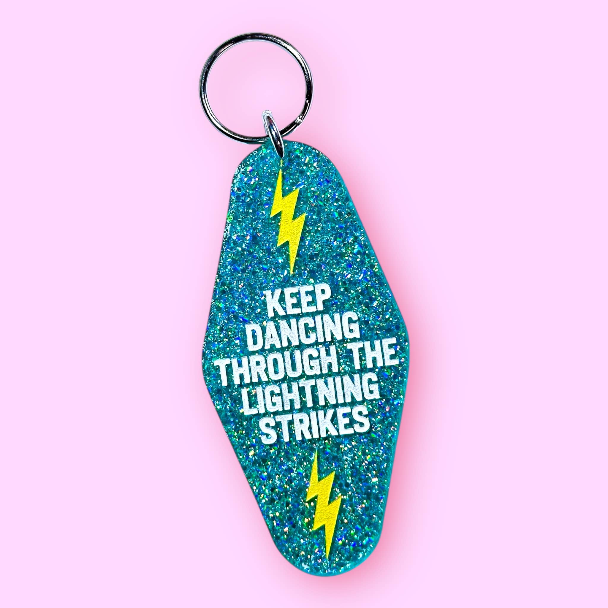 The Hissin' Kitten - Wholesale Keychain - Unisex - Keep Dancing Through The Lightning Strikes Keychain0