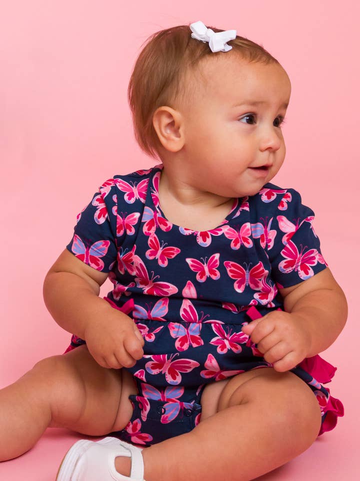 Navy Baby Girls Butterfly Bliss Knit Short Sleeve Bow Bubble Romper
for wholesale on Faire2