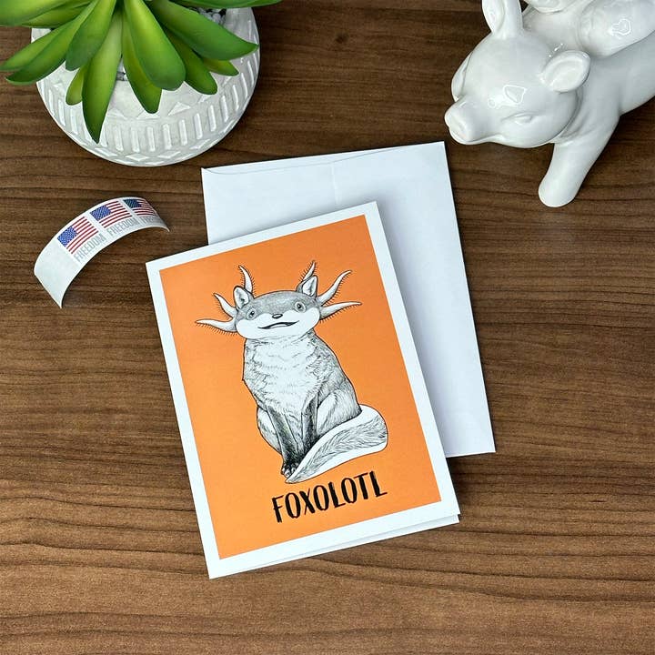 Whatif Creations – wholesale Everyday greeting card – Foxolotl 5x7" Greeting Card1