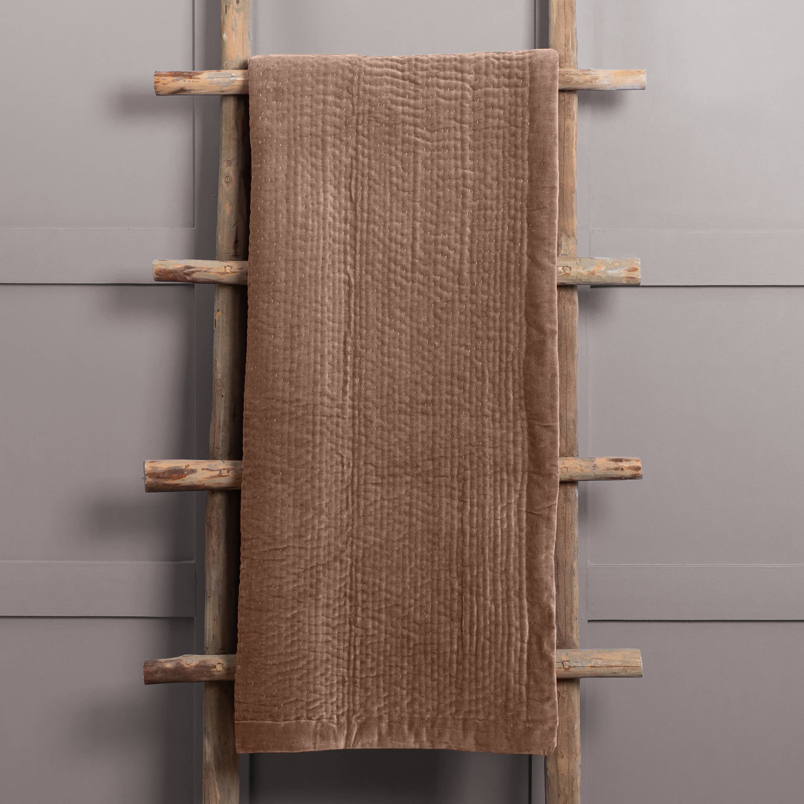 Haze Velvet Quilted Throw Coral for wholesale on Faire0