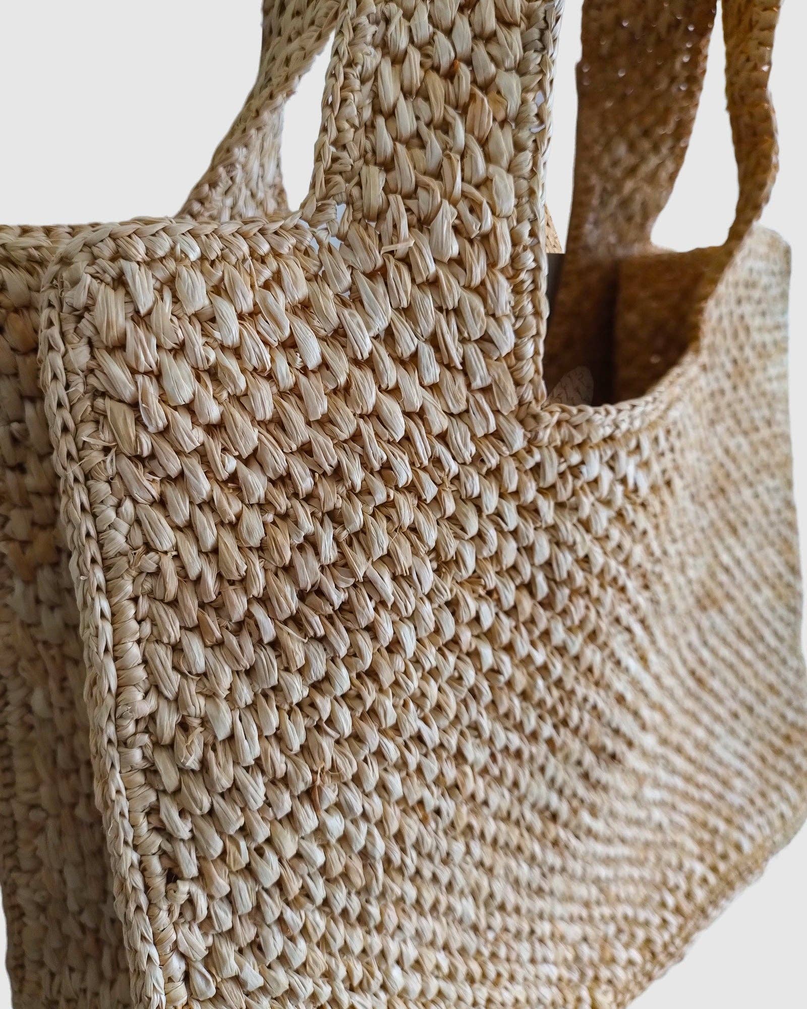 Pink Natural Miz Casa & Co Lani Raffia Basket Bag for wholesale on Faire1