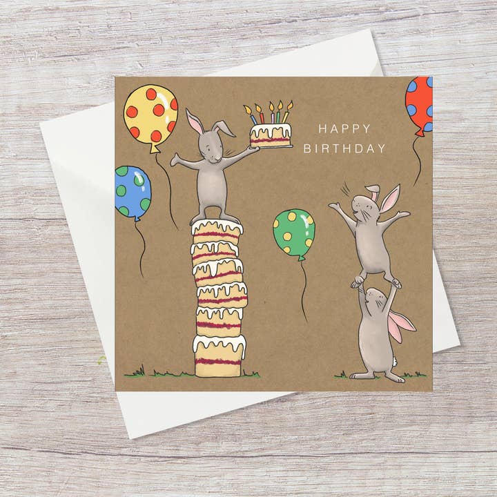 Birthday bunnies with balloons and cake - Birthday card for wholesale by Lucy Driver Illustration