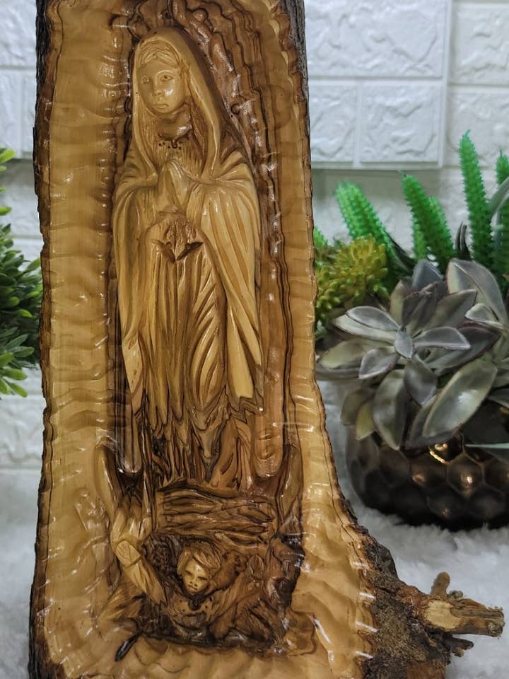 Guadalupe carved into Olive Wood branch for wholesale by Holyland Artisans