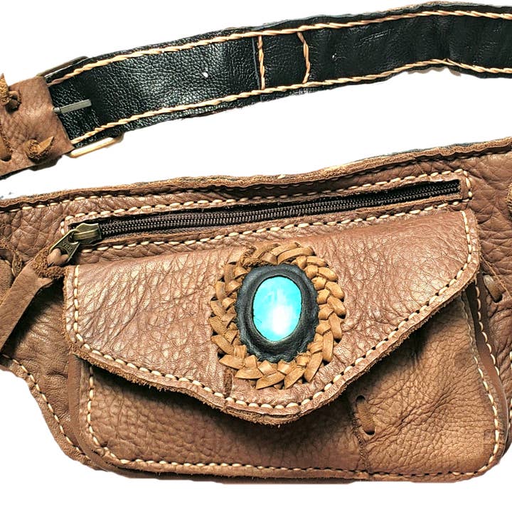 Handmade leather bohemian fanny bag with flap and hand selected semi- precious stone accent for wholesale by Atlas Goods By Your Needs Company
