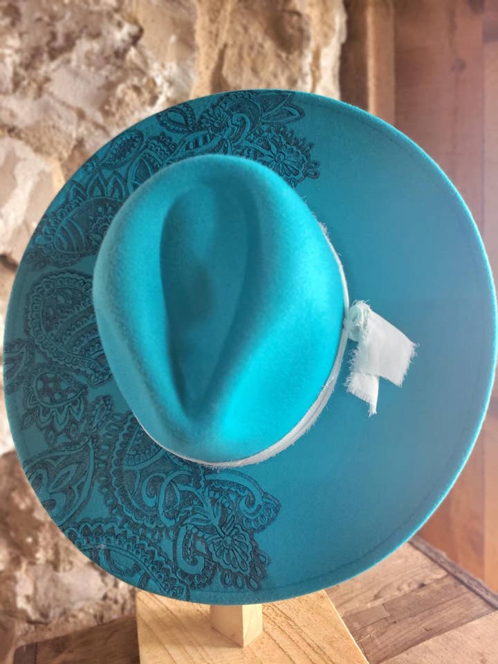 Free-hand burned beautiful teal vegan wool hat for wholesale by The Broody Hen