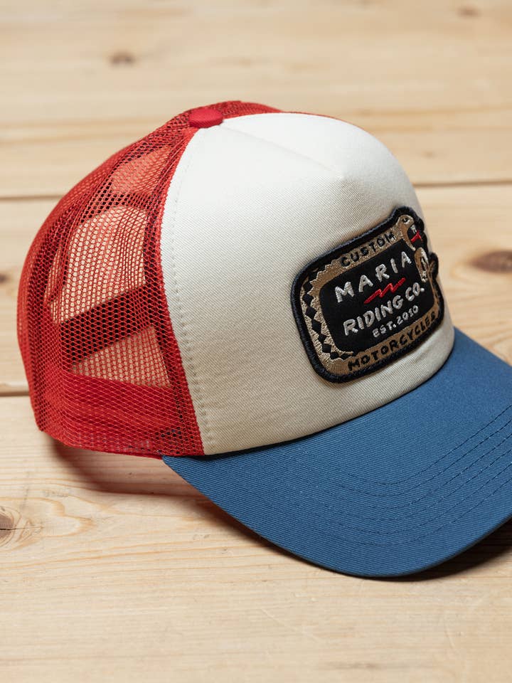Red / Blue / Raw White Snake Trucker Cap for wholesale by Maria Riding Company