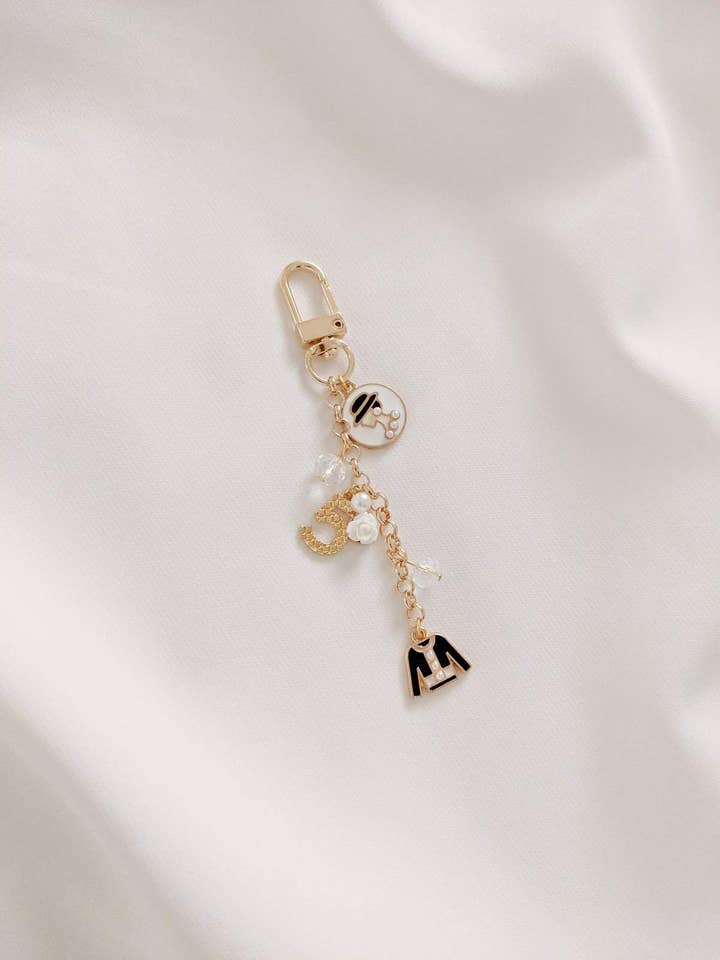 Coco de Cruise Noir ikoniske taske charme for engroshandel hos Ziaziari