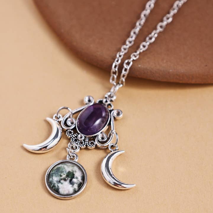 Triple Moon Amethyst Pendant Necklace and other Purchase Wholesale mystic moon. Free Returns & Net 60 Terms on Faire trending on Faire.