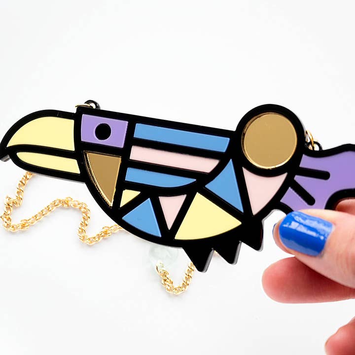 Bird 'memphis style' necklace on gold plated chain, in branded gift box for wholesale by designosaur