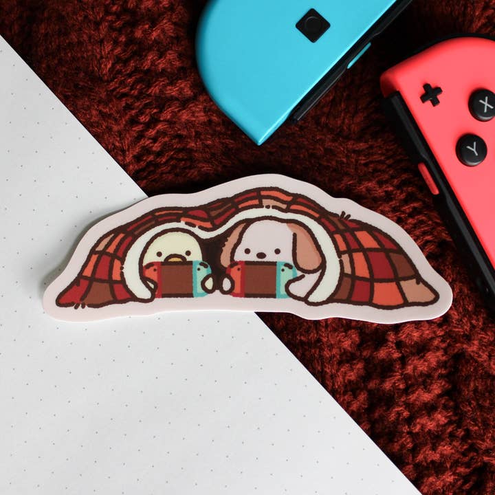 Cozy Gaming • Vinyl Sticker for wholesale by Sam’s Scribbles