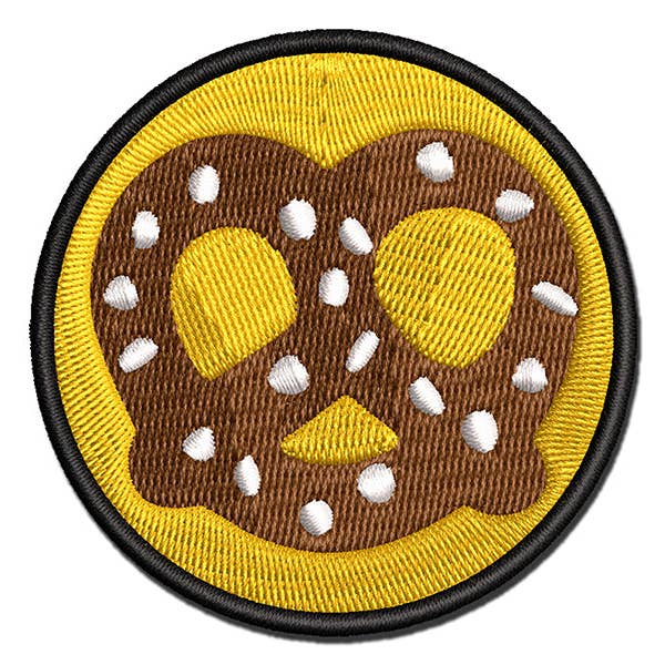 Patch thermocollant brodé multicolore en forme de bretzel allemand avec sel pour la vente par Sniggle Sloth