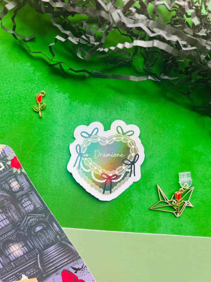 Dramione cake Inspired Holographic Sticker – Fantasy Bookish Laptop & Kindle Decal for wholesale by TheBookShack