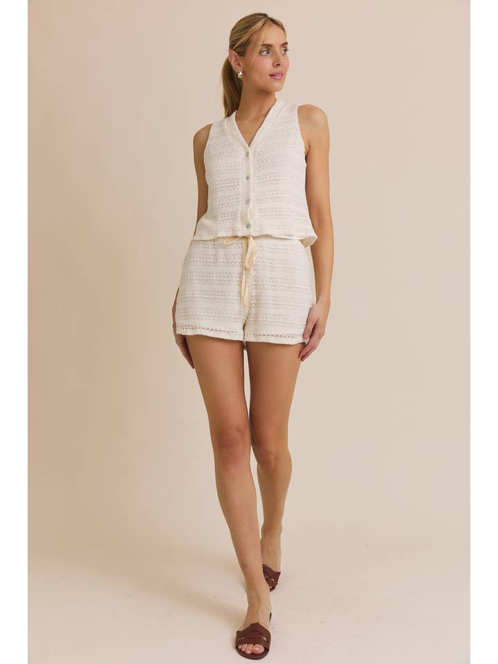 CREAM BUTTON UP SLEEVELESS CROCHET TOP AND WAIST TIE CROCHET SHORT for wholesale on Faire